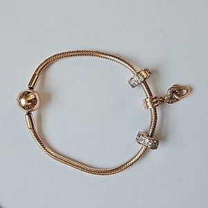 Rose Colored Pandora Braclet With Charms